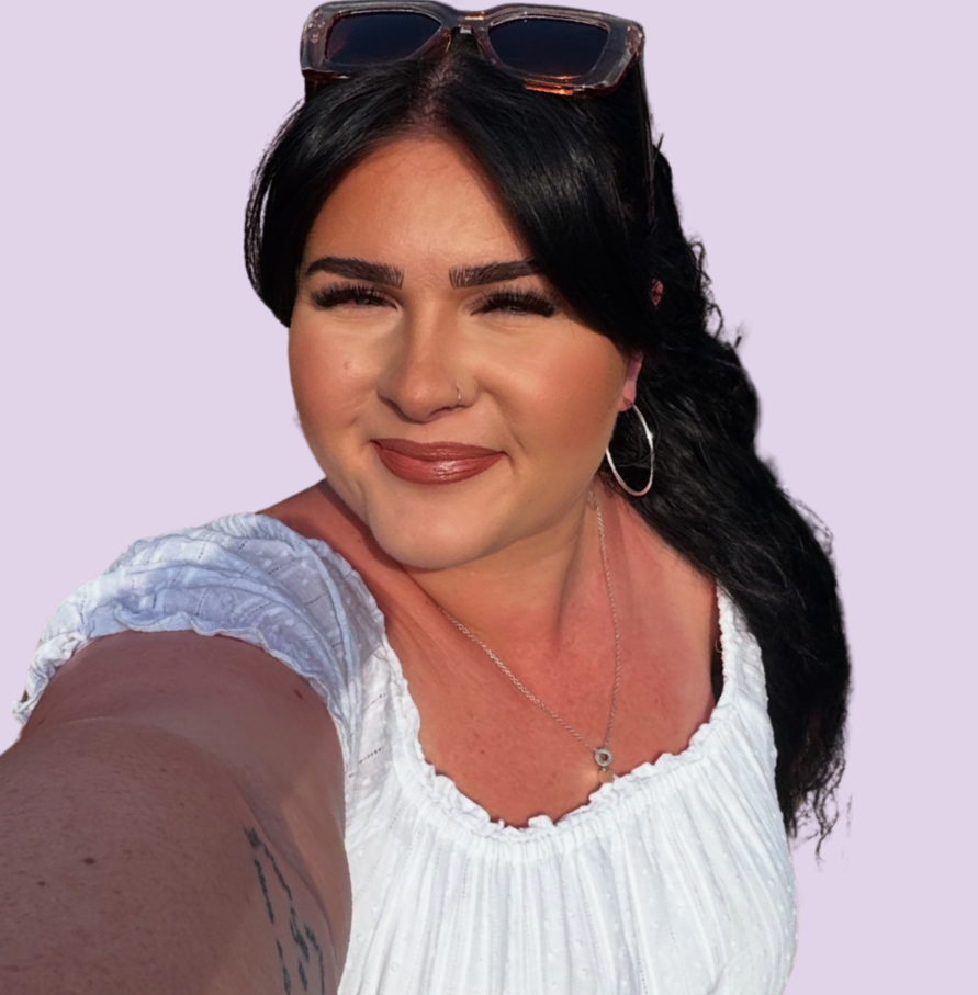 Woman smiling wearing a white dress